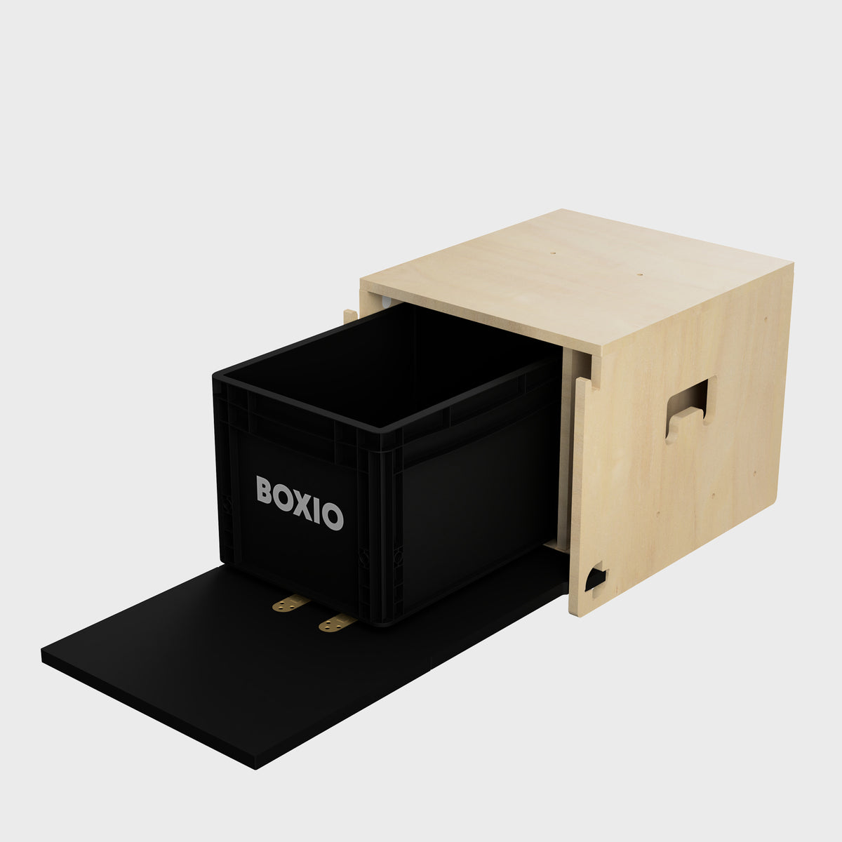Schwarze Aufbewahrungsbox mit "BOXIO"-Logo, teilweise in Holzschublade eingesetzt, auf schwarzem Untergrund.