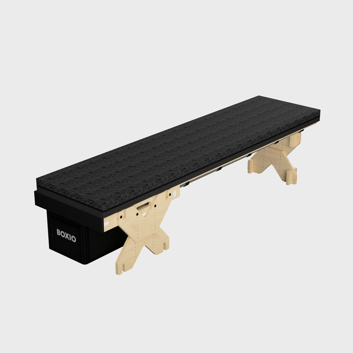 Schwarzer Tisch mit einer strukturierten Oberfläche, gestützt von einem stabilen Holzgestell und einer Aufbewahrungsbox.