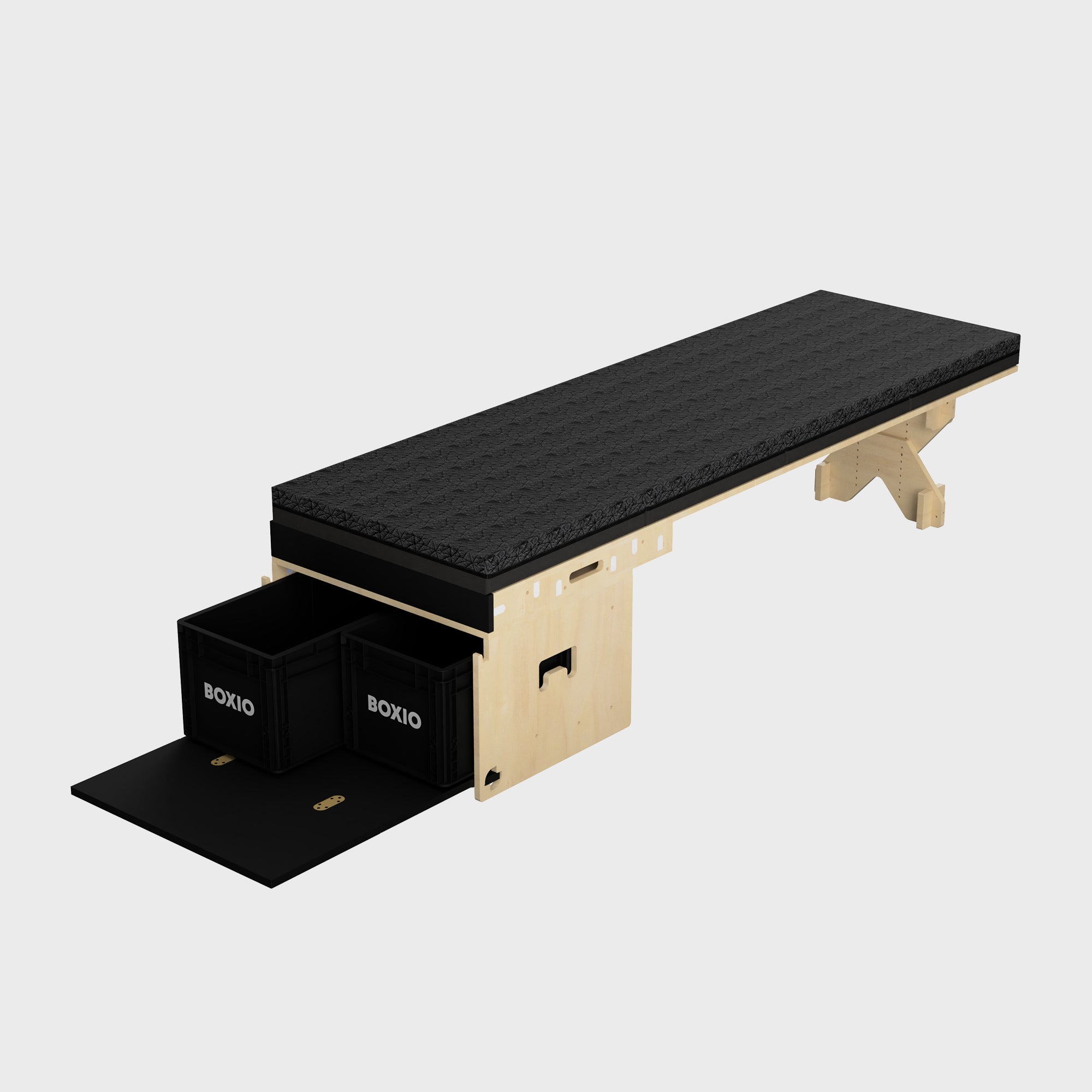 Sicherheitsliege mit schwarzer Polsterung und zwei herausziehbaren Aufbewahrungsboxen. Ideal für Therapie und Fitness.