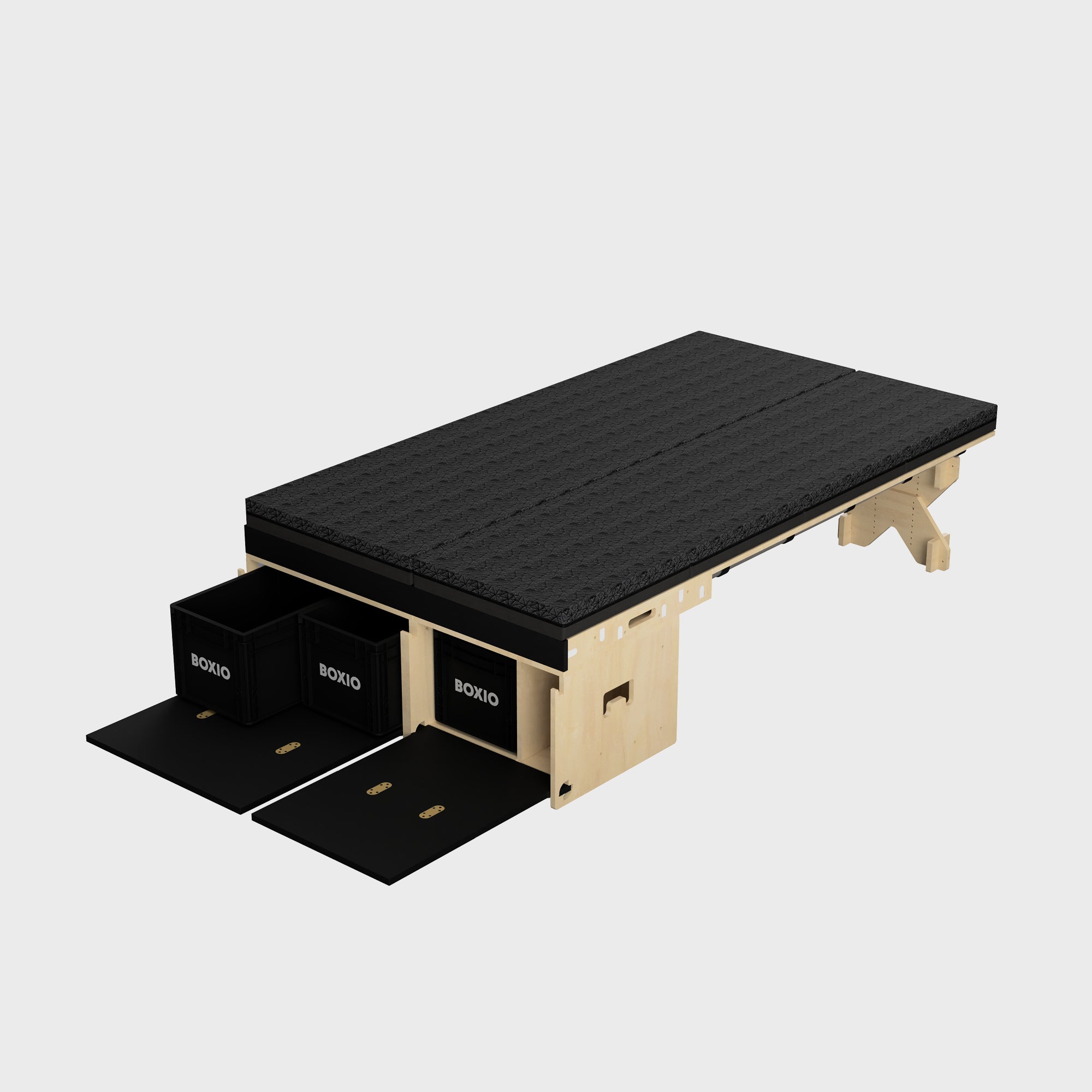 Modularer Tisch mit schwarzer Oberplatte und Holzgestell, ausgestattet mit zwei Aufbewahrungsboxen.