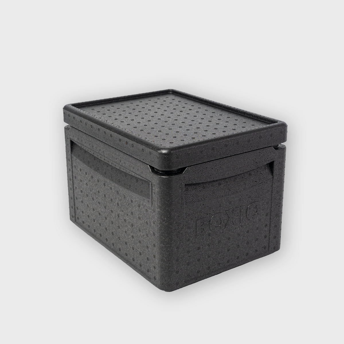 Schwarze Aufbewebox mit perforierter Oberfläche und Griff, ideal für die Organisation von Gegenständen.
