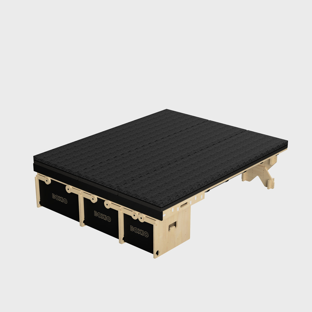 Modularer, schwarzer Plattformtisch mit Holzrahmen und drei integrierten Boxen. Ideal für moderne Innenräume.