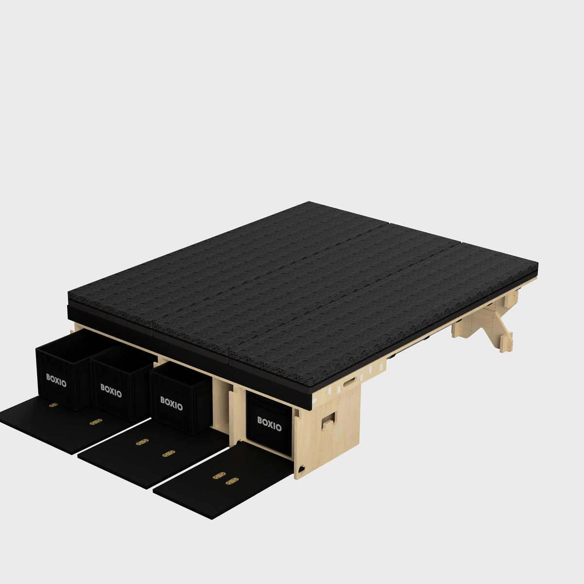 Modulares Regalsystem mit schwarzer Oberflächenstruktur und Stauraum in Holzoptik für Boxen.