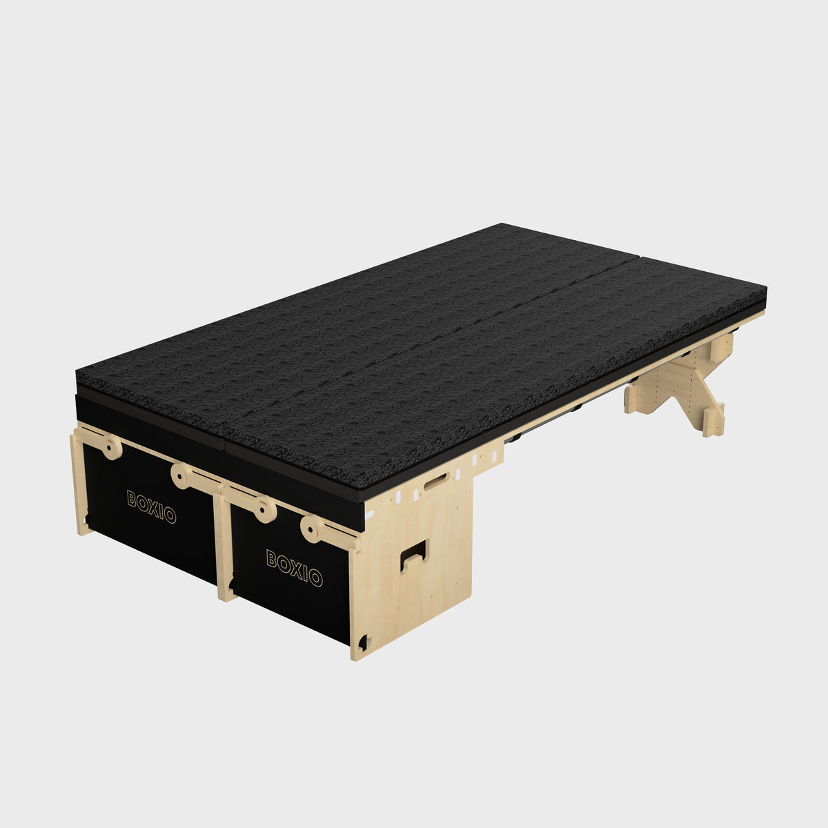 Modulares Schlafsystem mit schwarzer Polsteroberfläche und Untergestell aus Holz. Ideal für flexible Wohnlösungen.